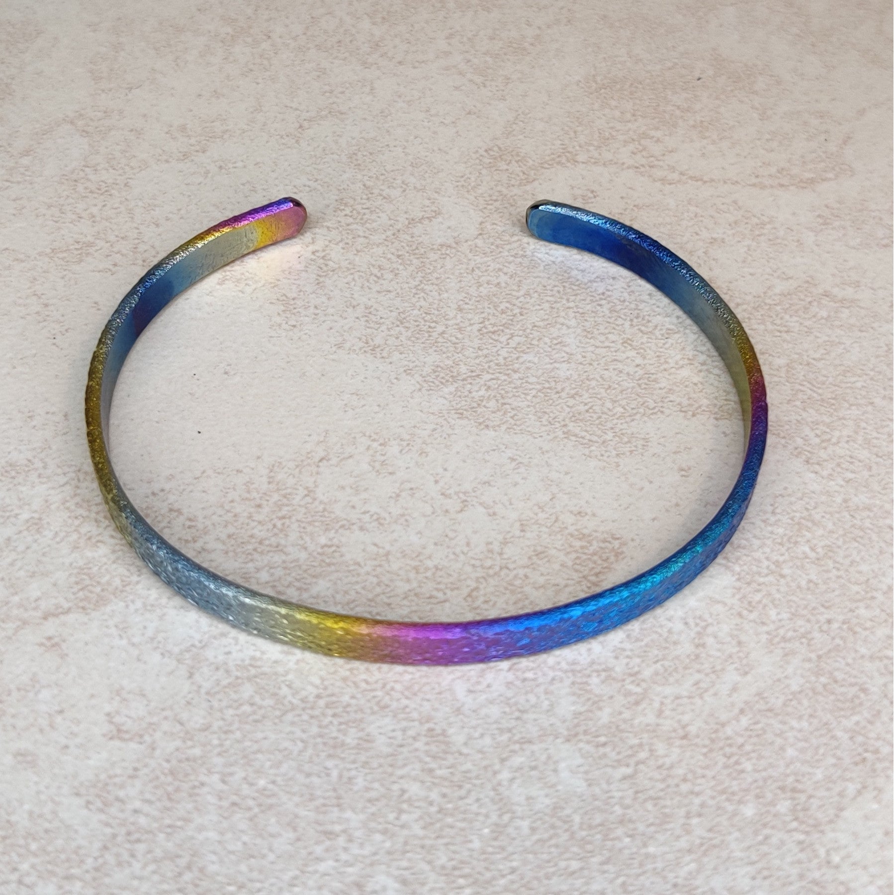 Niobium Bracelet With Rainbow Finish and a Light Mock Pavé ™ © Texture
