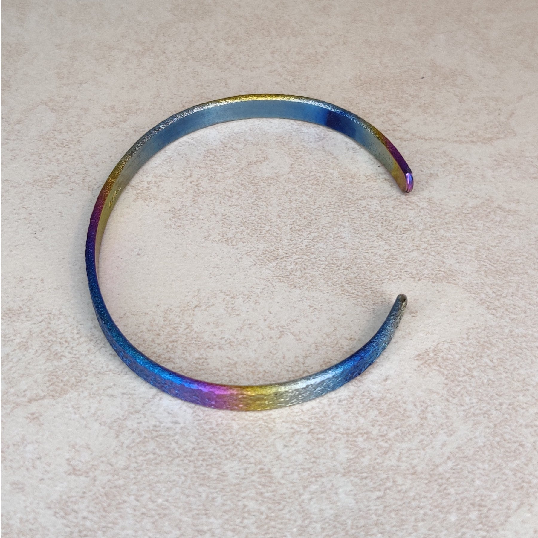 Niobium Bracelet With Rainbow Finish and a Light Mock Pavé ™ © Texture
