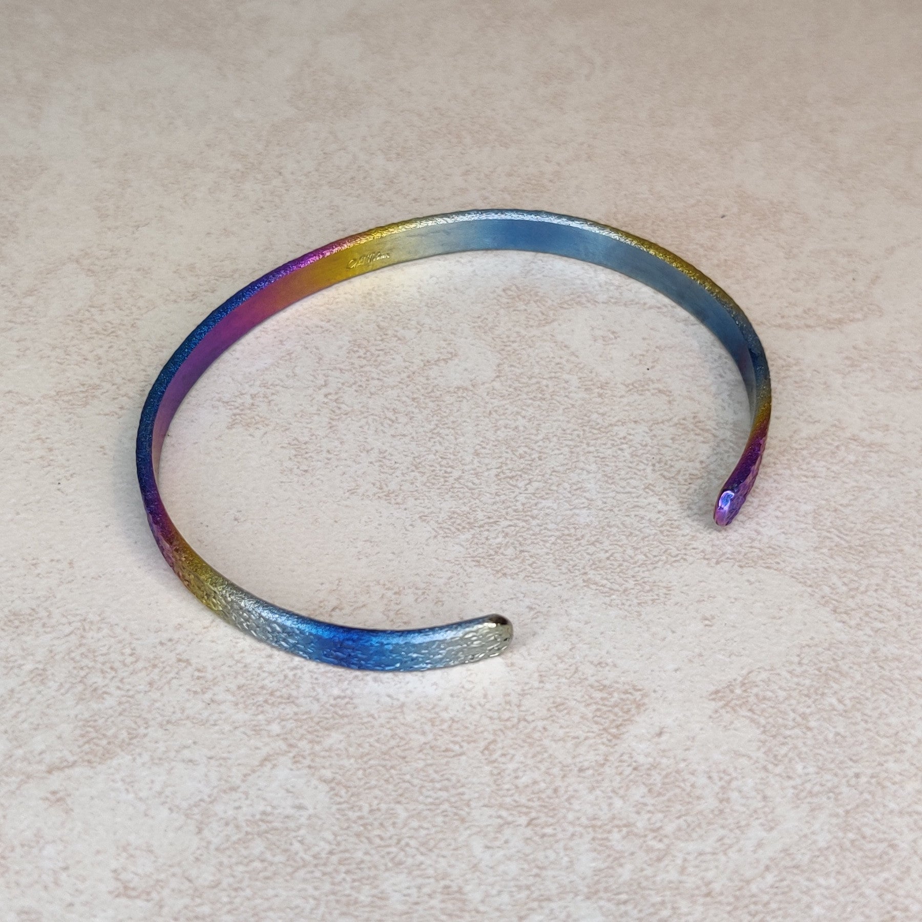 Niobium Bracelet With Rainbow Finish and a Light Mock Pavé ™ © Texture